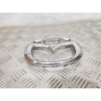 Эмблема решетки радиатора EG2151730 MAZDA CX-7 2,3 (2006-2012)