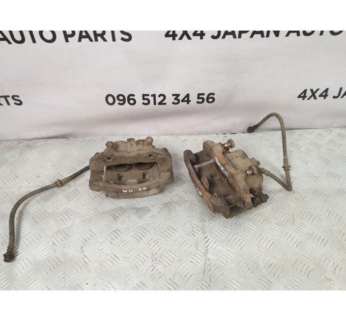 скоба супорта переднього NISSAN X-TRAIL T30 (2002-2008) 411338H300